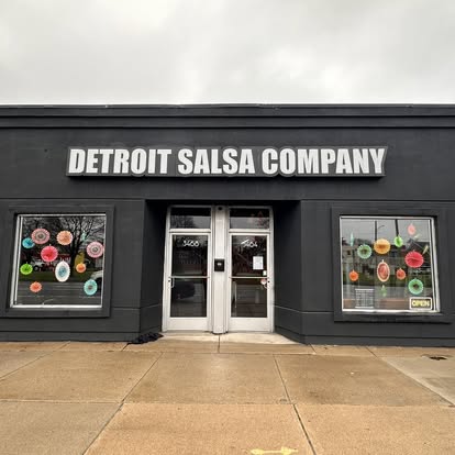 3464 Fort St after the remodel: painted black with DETROIT SALSA COMPANY lettered above the door.