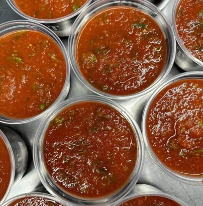 Cups of red salsa from above.