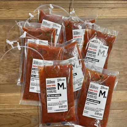 Red salsa packed in blood bags labeled Salsa Cells for Halloween.